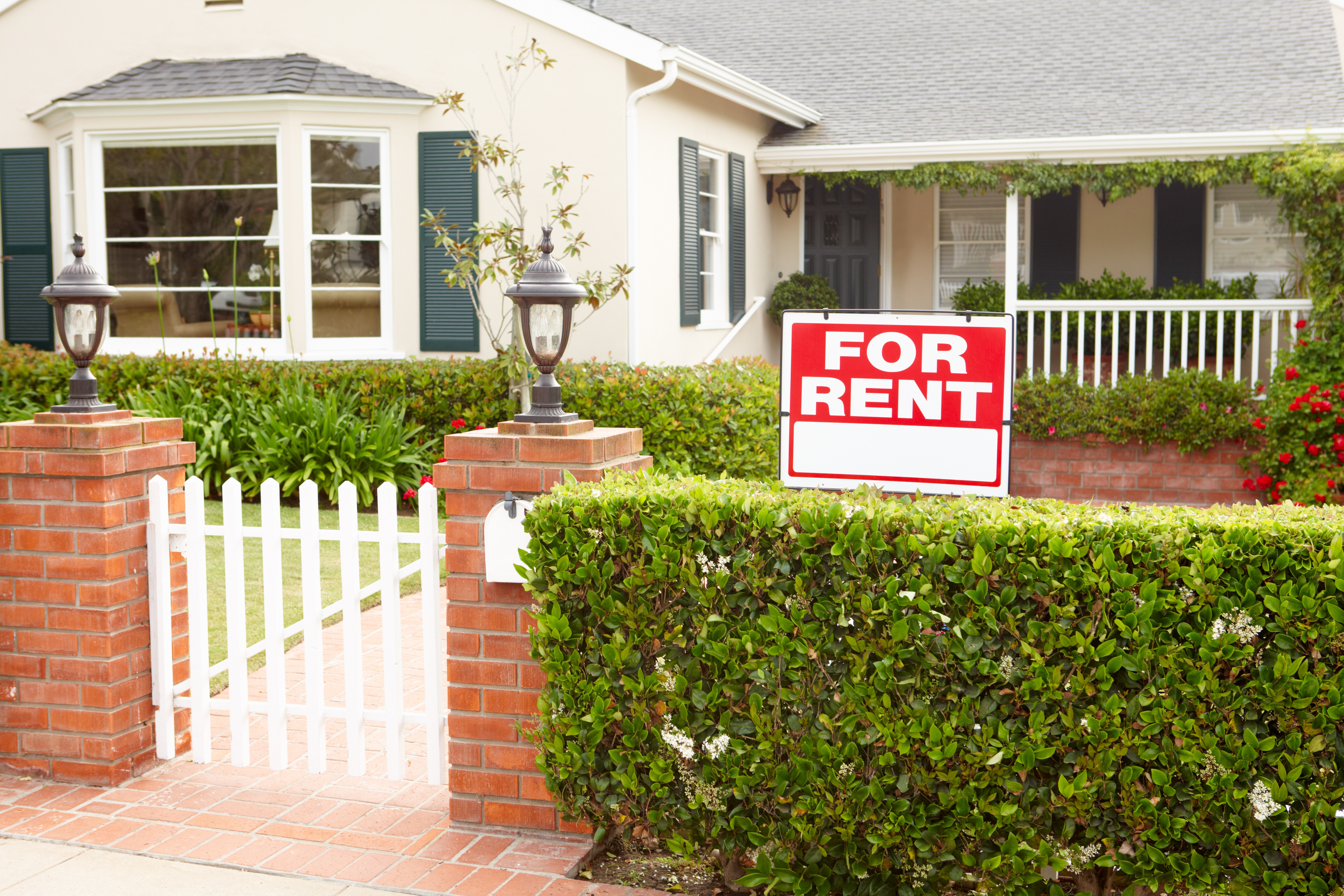 house with a for rent sign