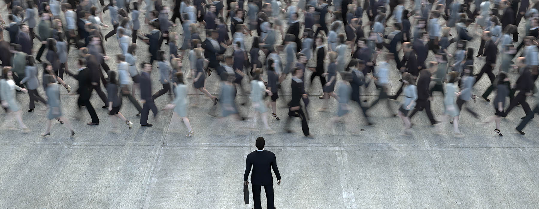 Crowd of people walking down a busy street