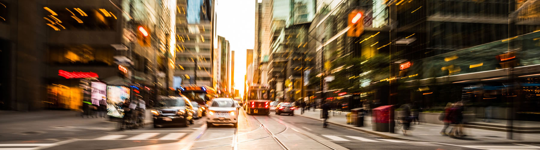 Vehicles at an intersection in a busy metropolitan area